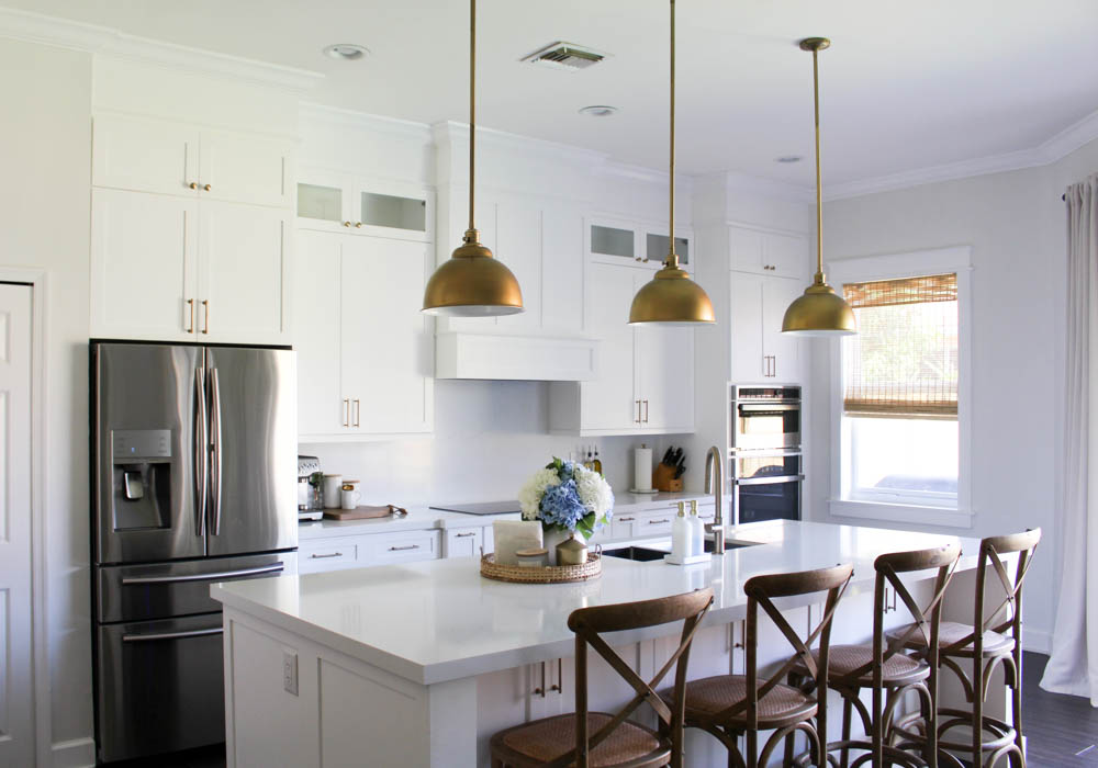 Gold Pendants In White Kitchen