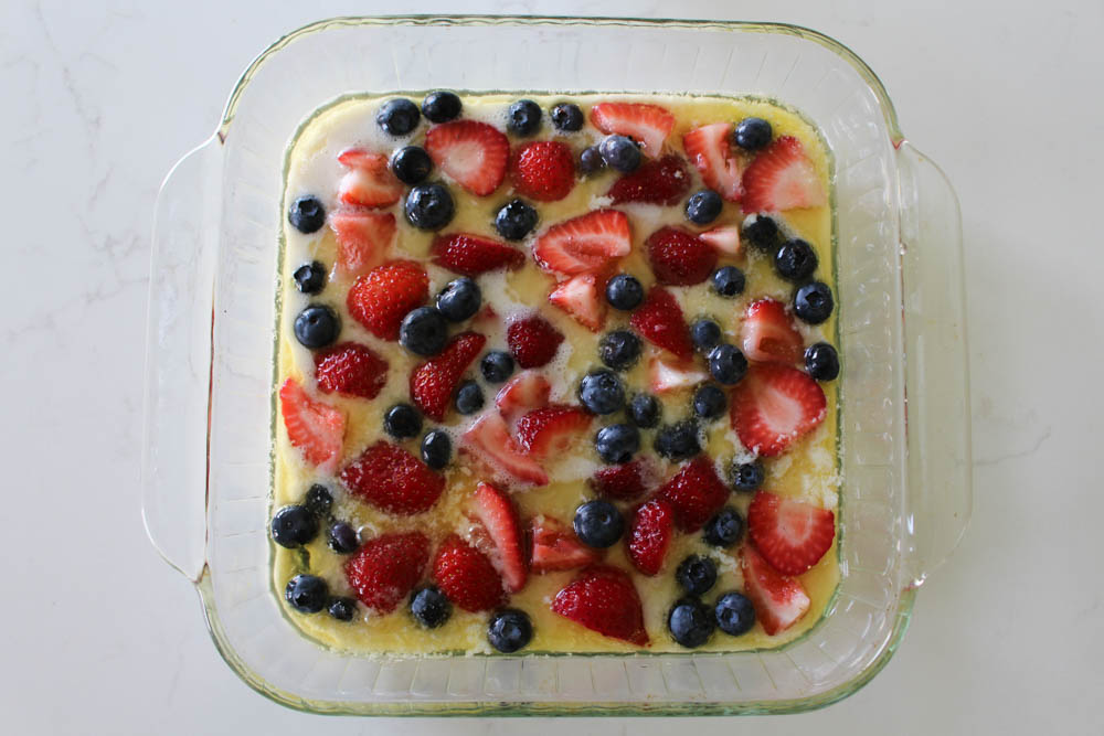 Spoon Strawberries And Blueberries Into Your Batter