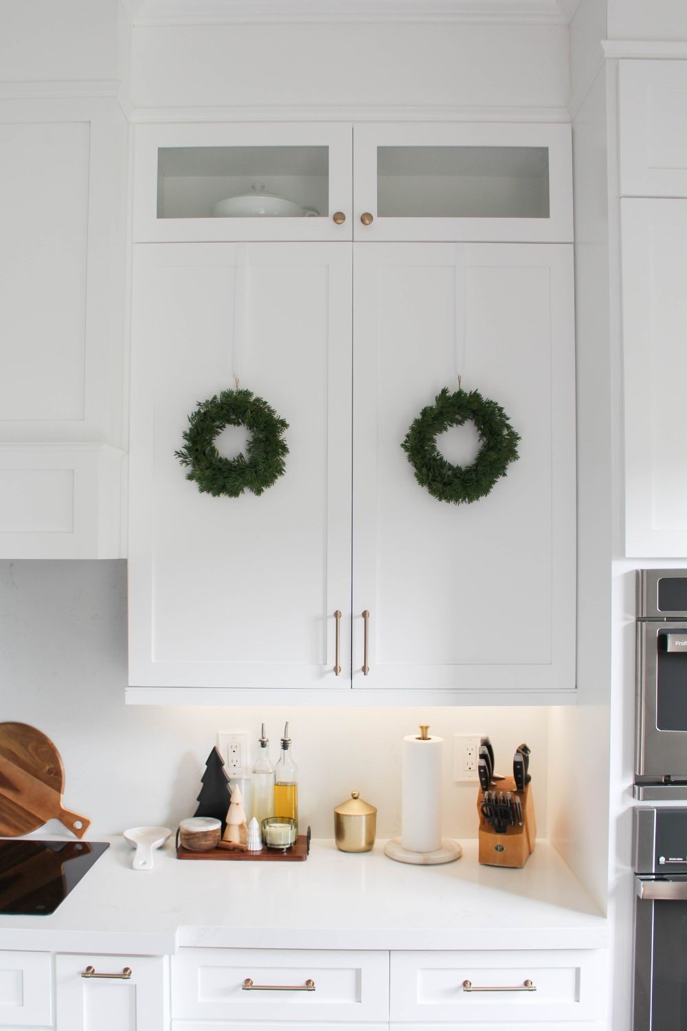 Mini Christmas Wreaths On Kitchen Cabinets